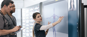 Woman using Surface Hub in Healthcare
