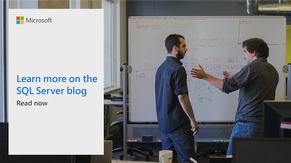Two men working at a whiteboard.